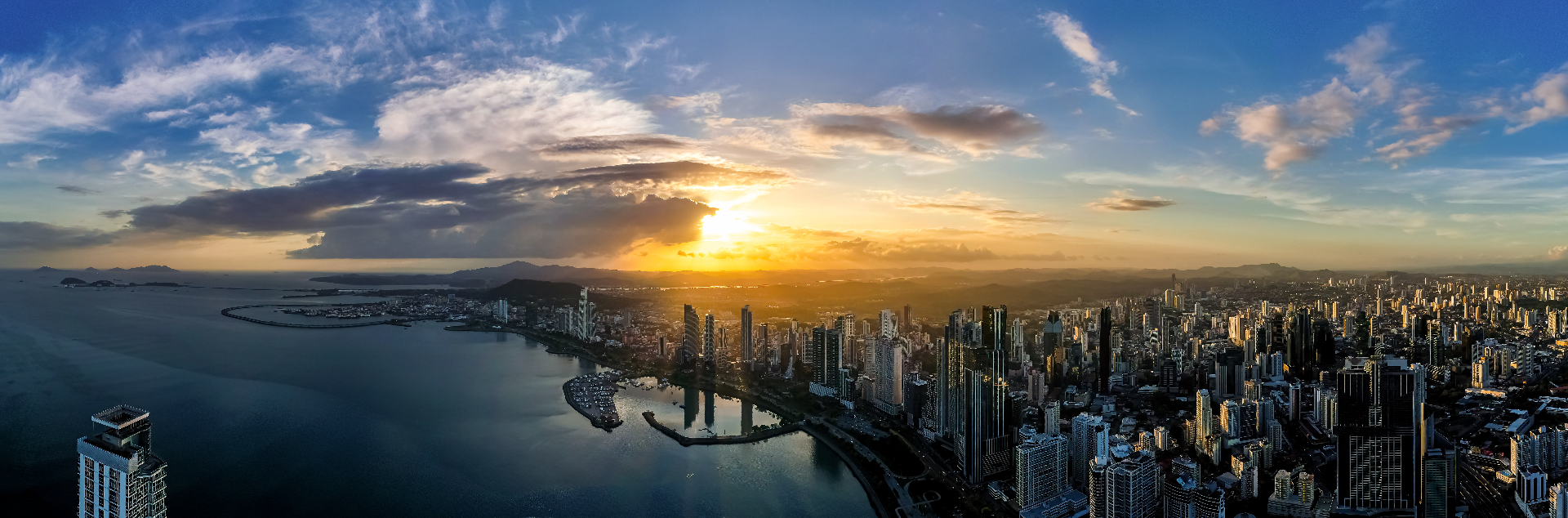 Panama City skyline at sunset over the Pacific Ocean